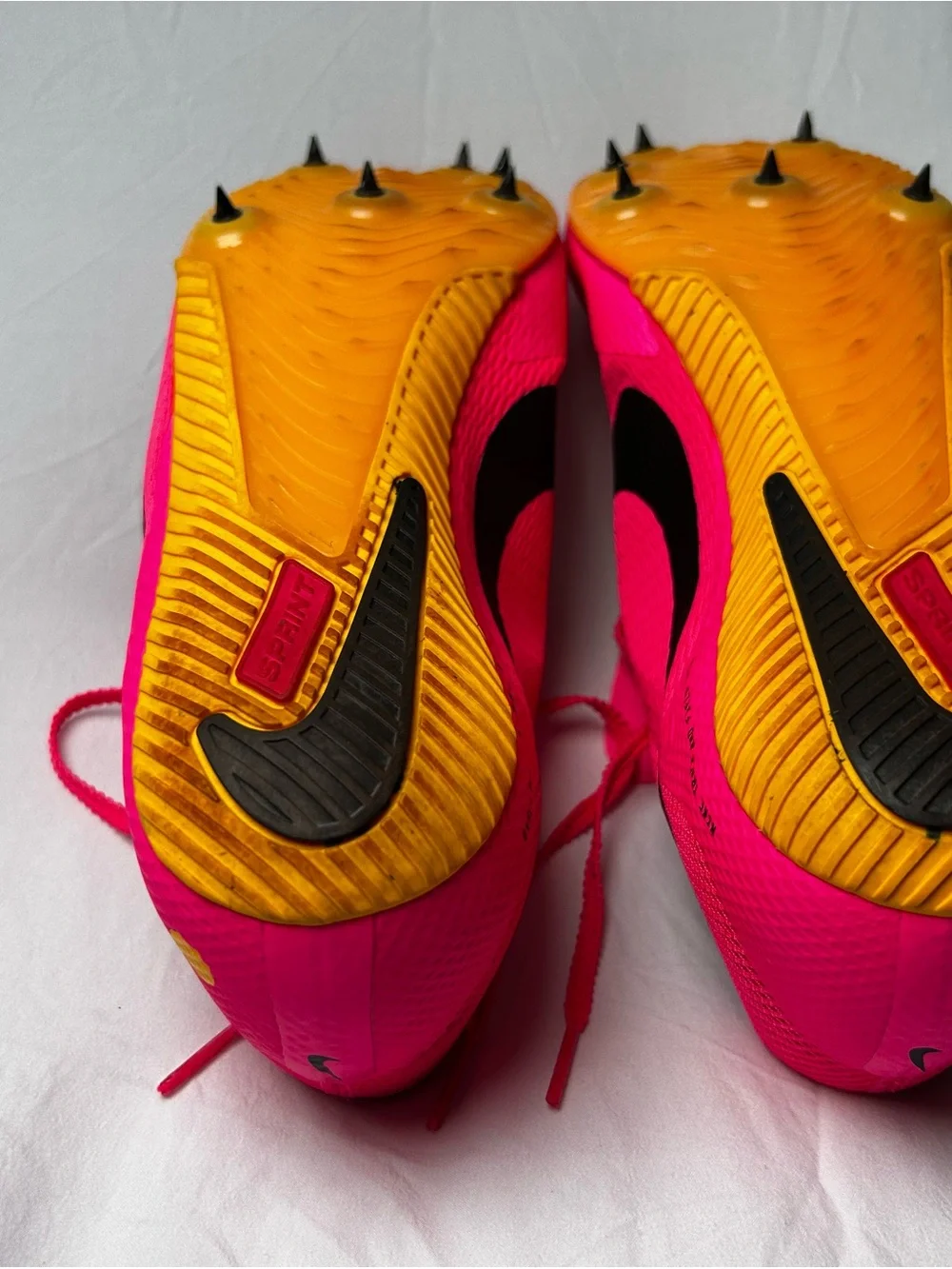 Nike Bright Pink Athletic track with Black Swoosh men’s 10/1/2
